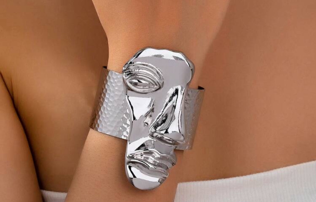 Ms. Faces silver bracelet
